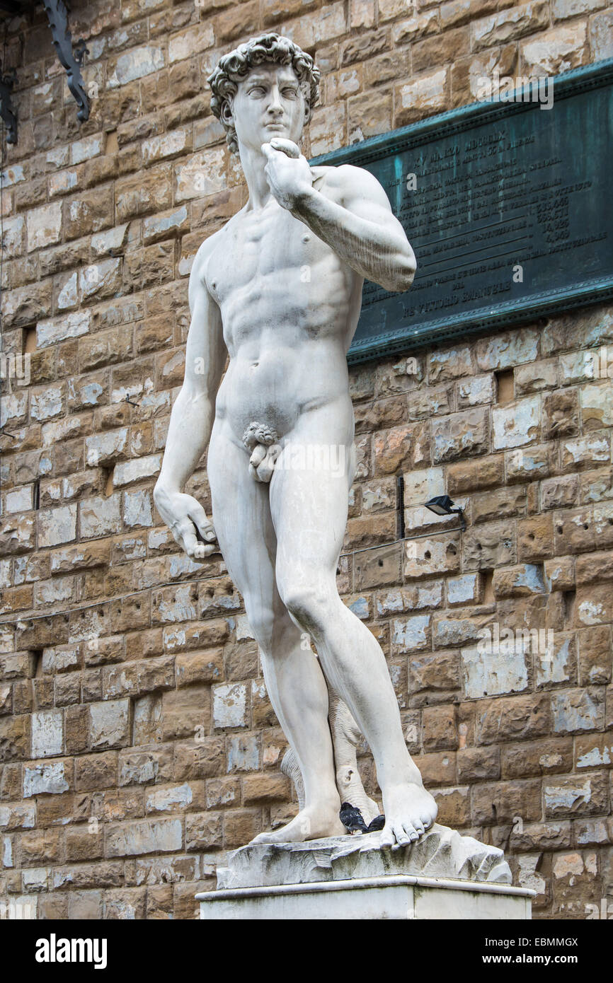 A copy of the statue of David by Michelangelo, in the background of the Palazzo Vecchio in Piazza della Signoria in Florence Stock Photo