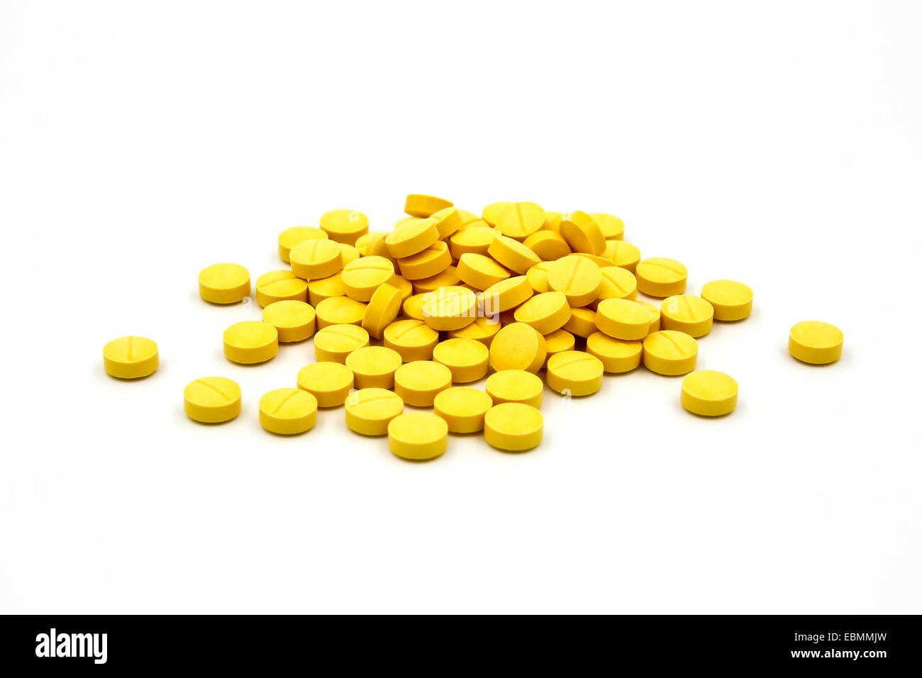 Yellow pills on white background Stock Photo Alamy