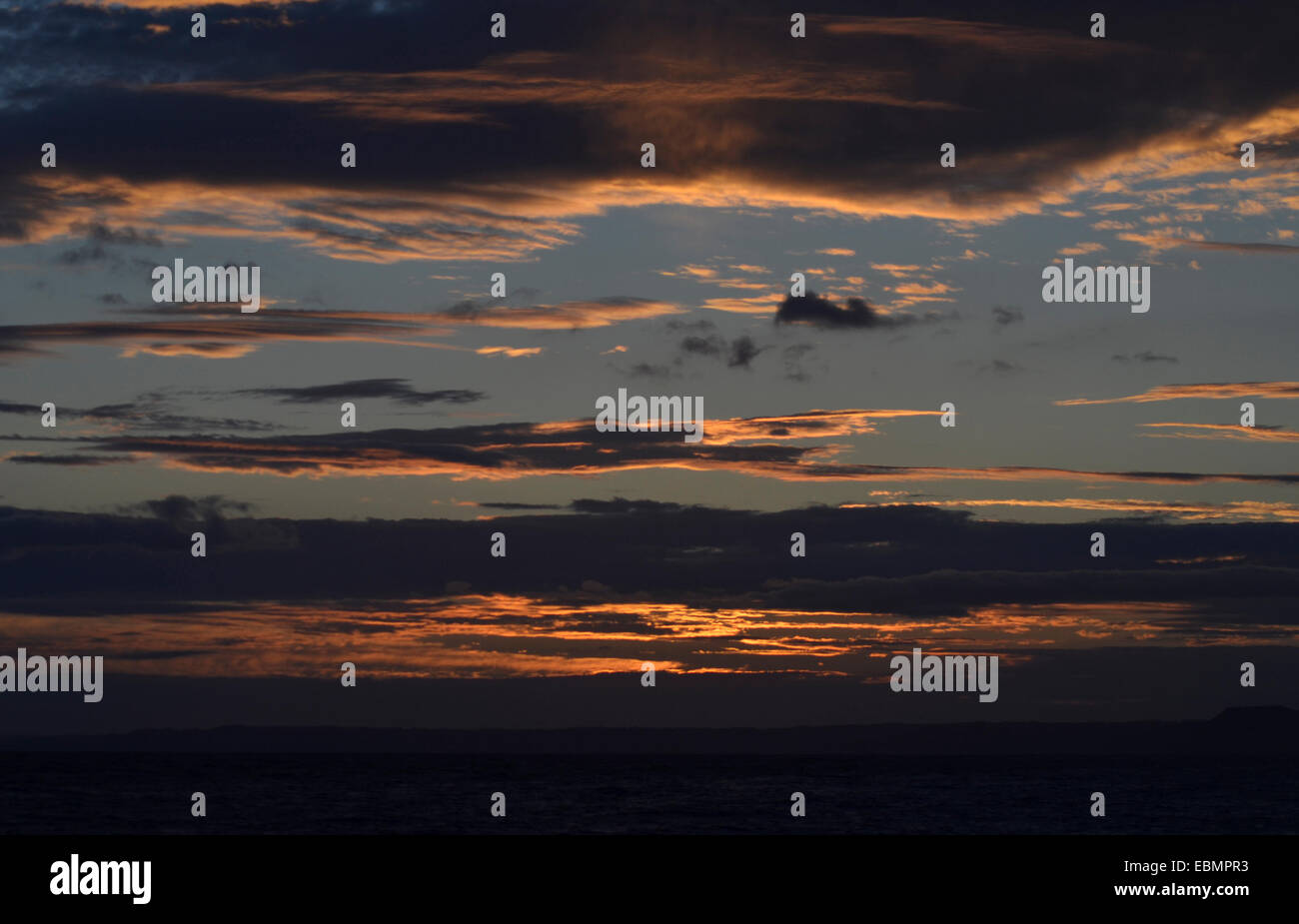 .sun set with orange sky line Stock Photo