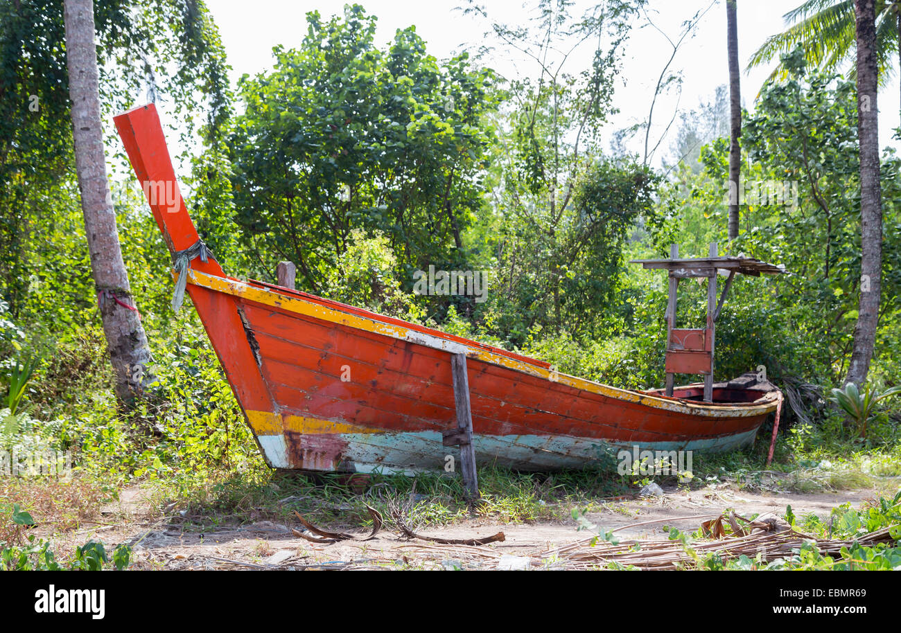 Jungle and boat wreck on the beach Stock Photo