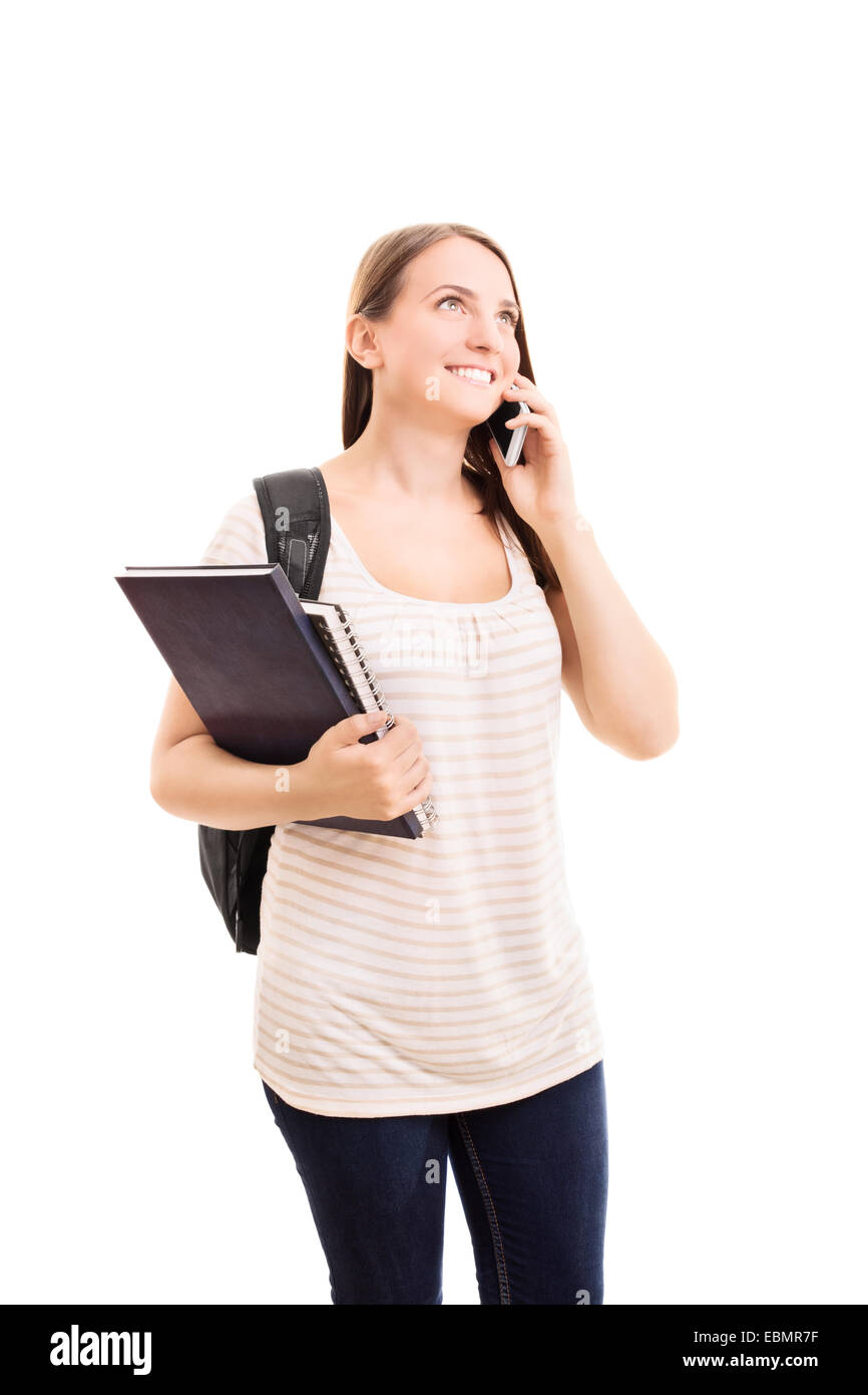 Smiling beautiful young student girl with a backpack, holding books and ...