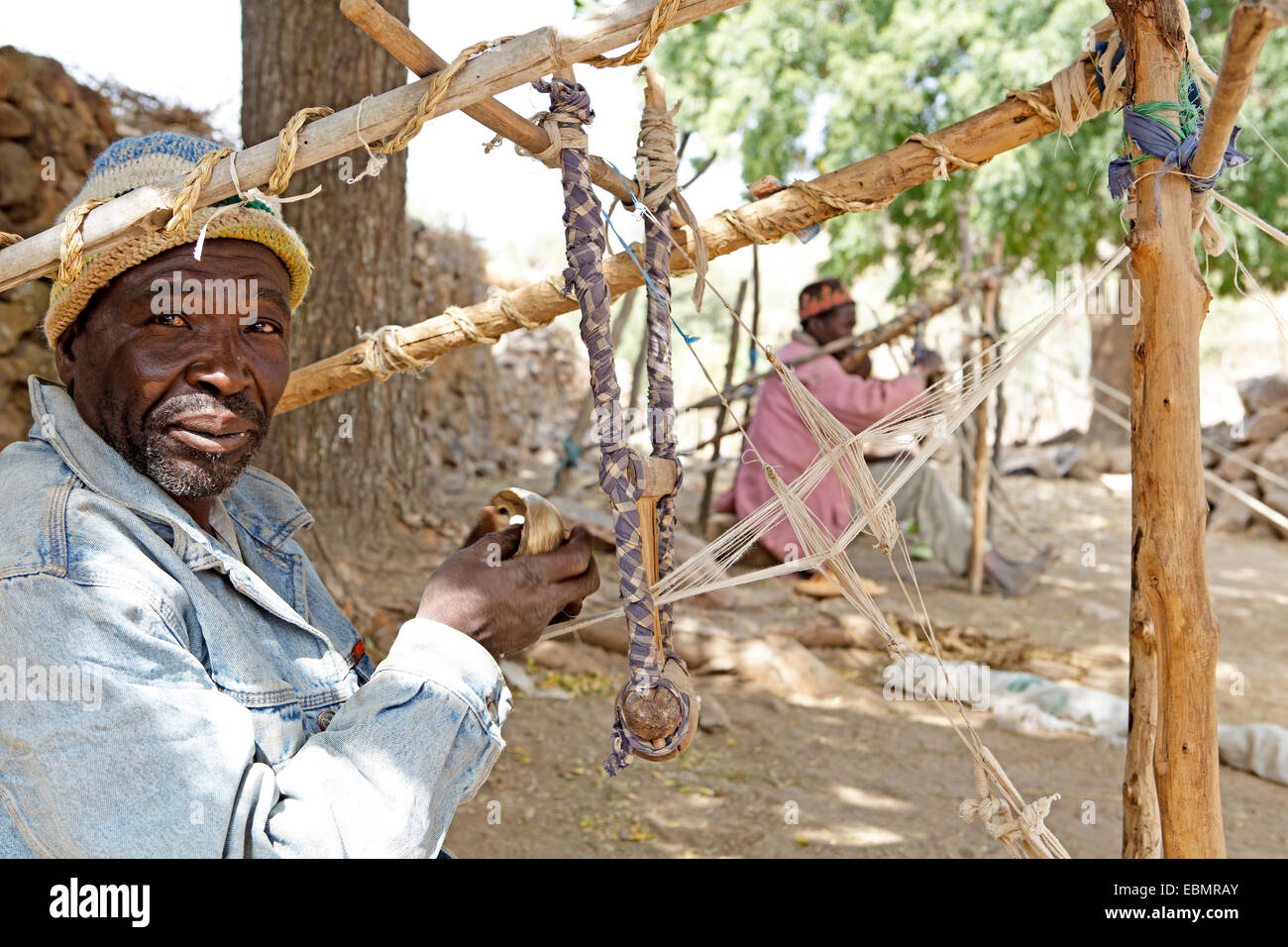 Man working on a loom, Rhumsiki, Far North, Cameroon Stock Photo