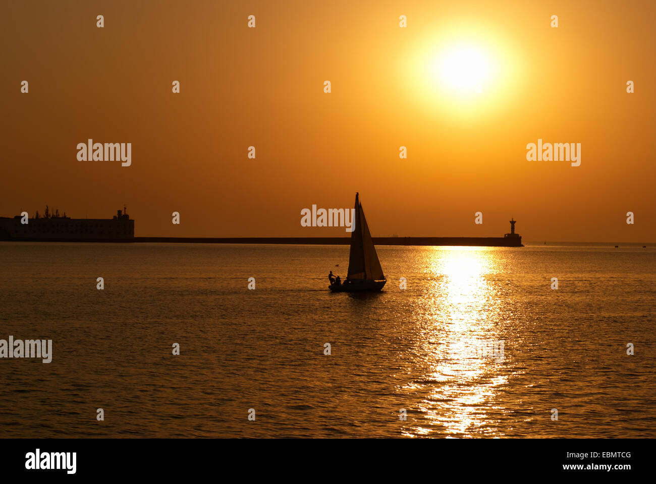 Sail boat against sea sunset. Colorful marine landscape Stock Photo - Alamy