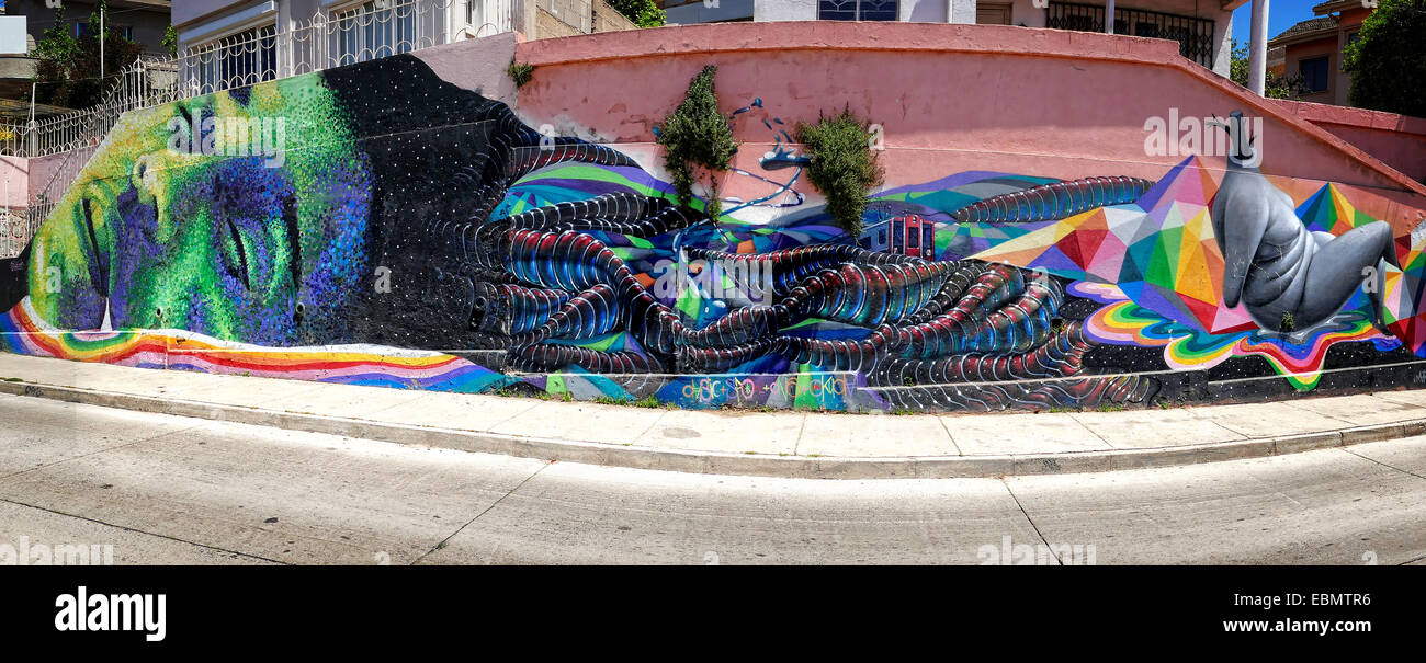 VALPARAISO; CHILE- OCTOBER  29,  2014 :Panorama picture of a  graffiti with a dreaming person as subject Stock Photo