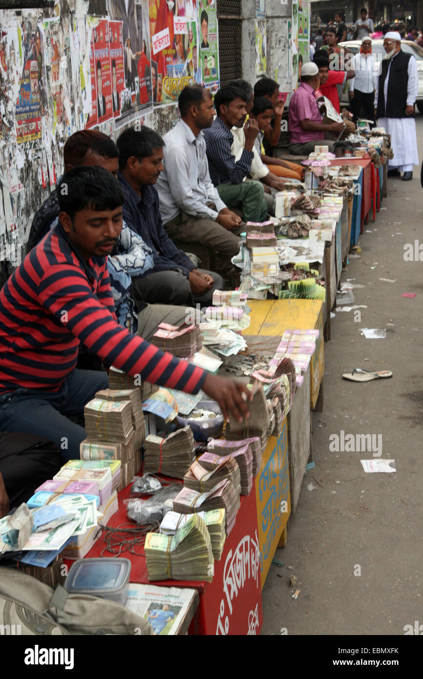 December 2014.Note dealers are buying old, dirty and unusable bills at Gulistan area in dhaka. Customers can buy/exchange their old bills from them in return of new notes. Stock Photo
