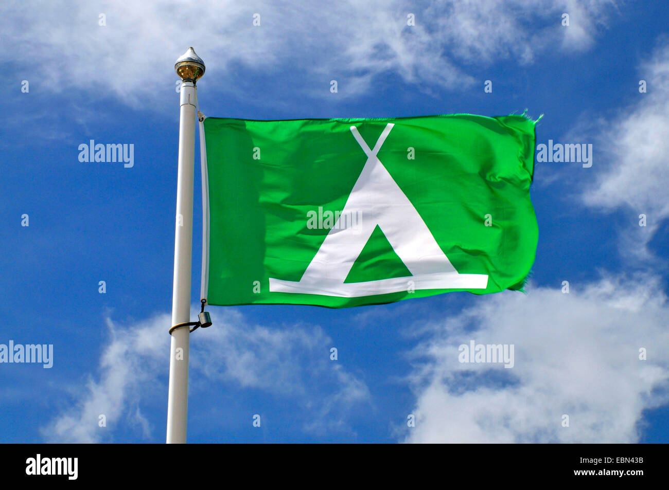 camping flag blowing in the wind, France, Brittany Stock Photo