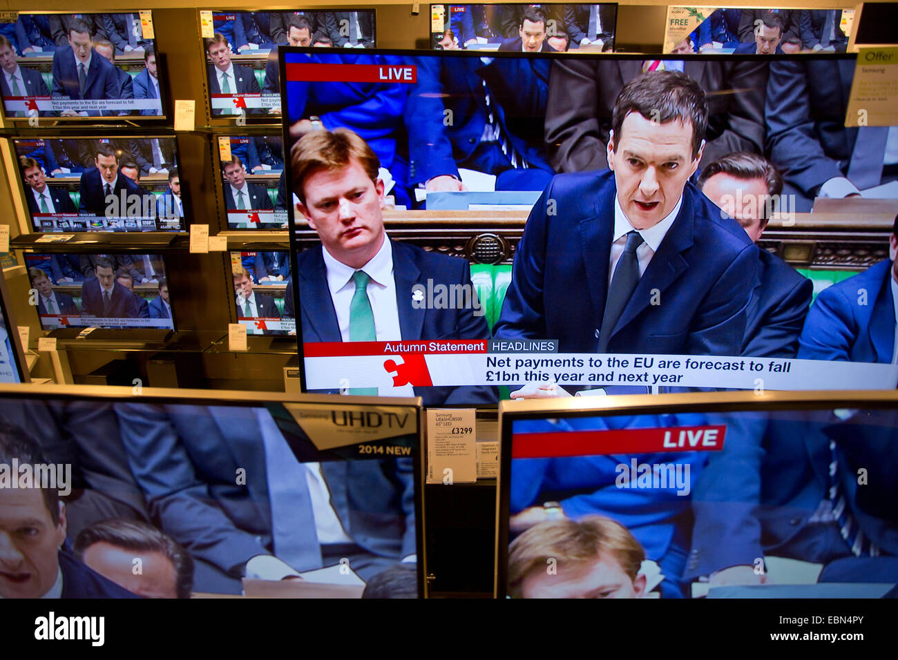Autumn Statement 3rd December 2014, London, UK Picture shows George Osborne, Chancellor of the Exchequer delivering his Autumn Statement to the House of Commons shown on multiple televisions in a central London department store. Stock Photo