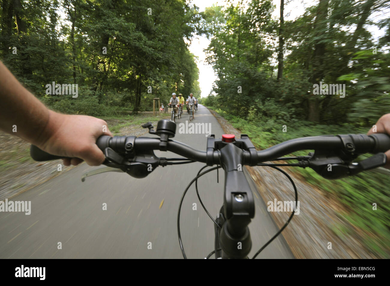 riding a bike on bike way and former railtrack 'Rheinischer Esel' , Germany, North Rhine-Westphalia, Ruhr Area, Witten Stock Photo