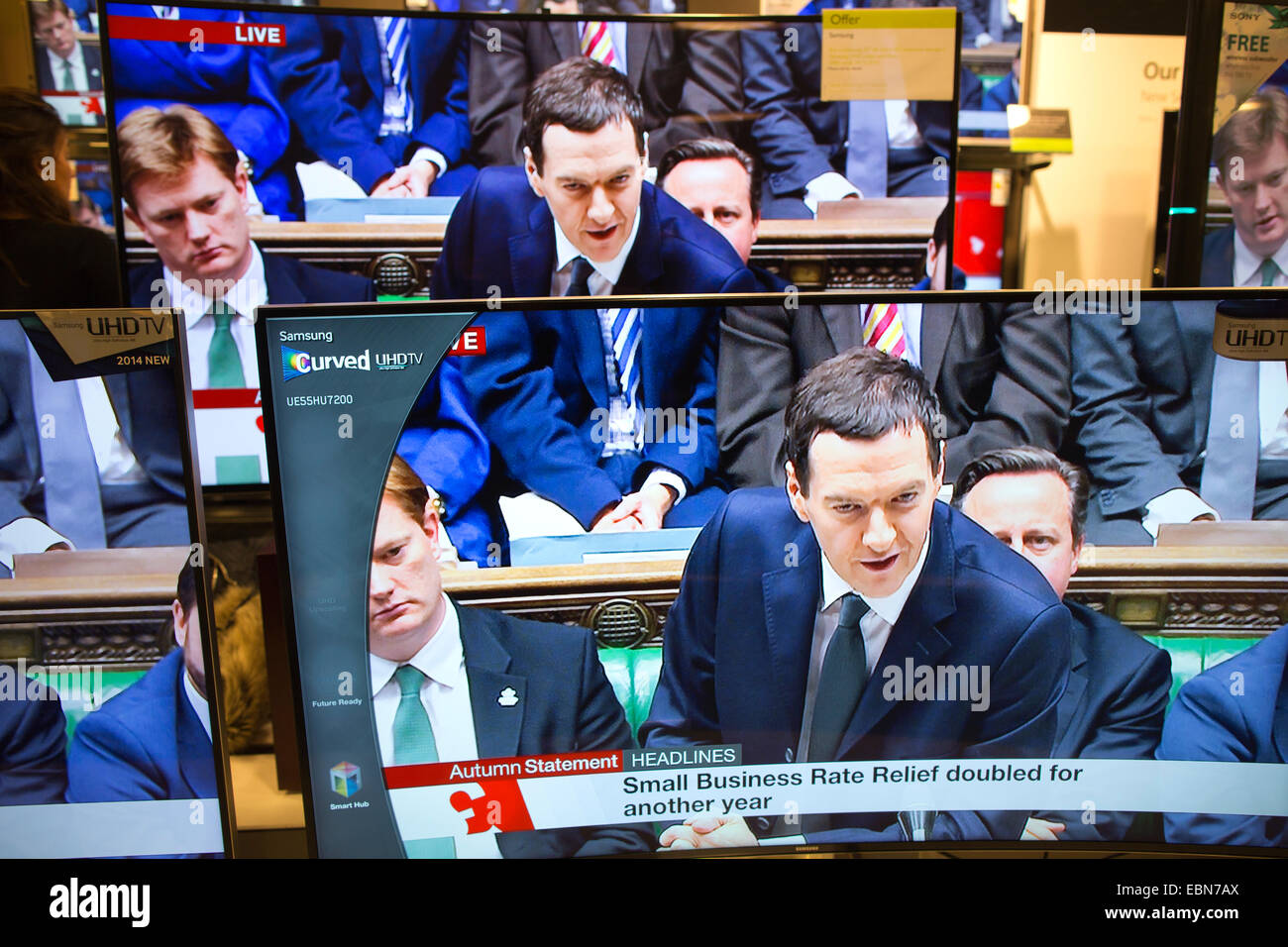 Autumn Statement 3rd December 2014, London, UK Picture shows George Osborne, Chancellor of the Exchequer delivering his Autumn Statement to the House of Commons shown on multiple televisions in a central London department store. Stock Photo