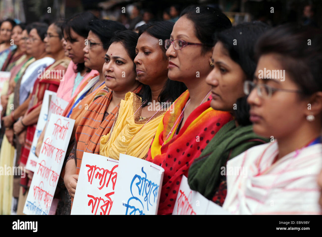 Dec. 3, 2014 - Dhaka, Bangladesh - Different women organization gathered and made human chain in front of National Press Club Dhaka protesting against child marriage in Bangladesh..Bangladesh has one of the highest rates of child marriage in the world. This survey shows that in Bangladesh, 64% of women currently aged 20â€“24 were married before the age of 18. This is despite the fact that the minimum legal age of marriage for females in Bangladesh is 18 years and 21 for males. (Credit Image: © Zakir Hossain Chowdhury/ZUMA Wire) Stock Photo