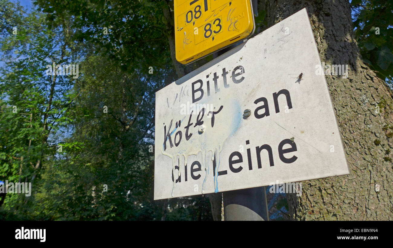 sign labeled 'mutts on the lead', Germany Stock Photo