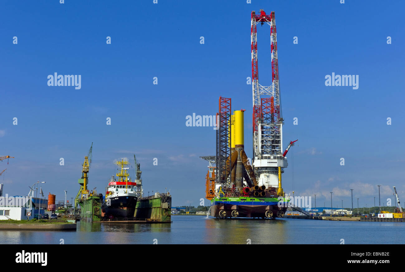 transport ship with tripos for offshore wind parks at harbour, Germany, Bremerhaven Stock Photo