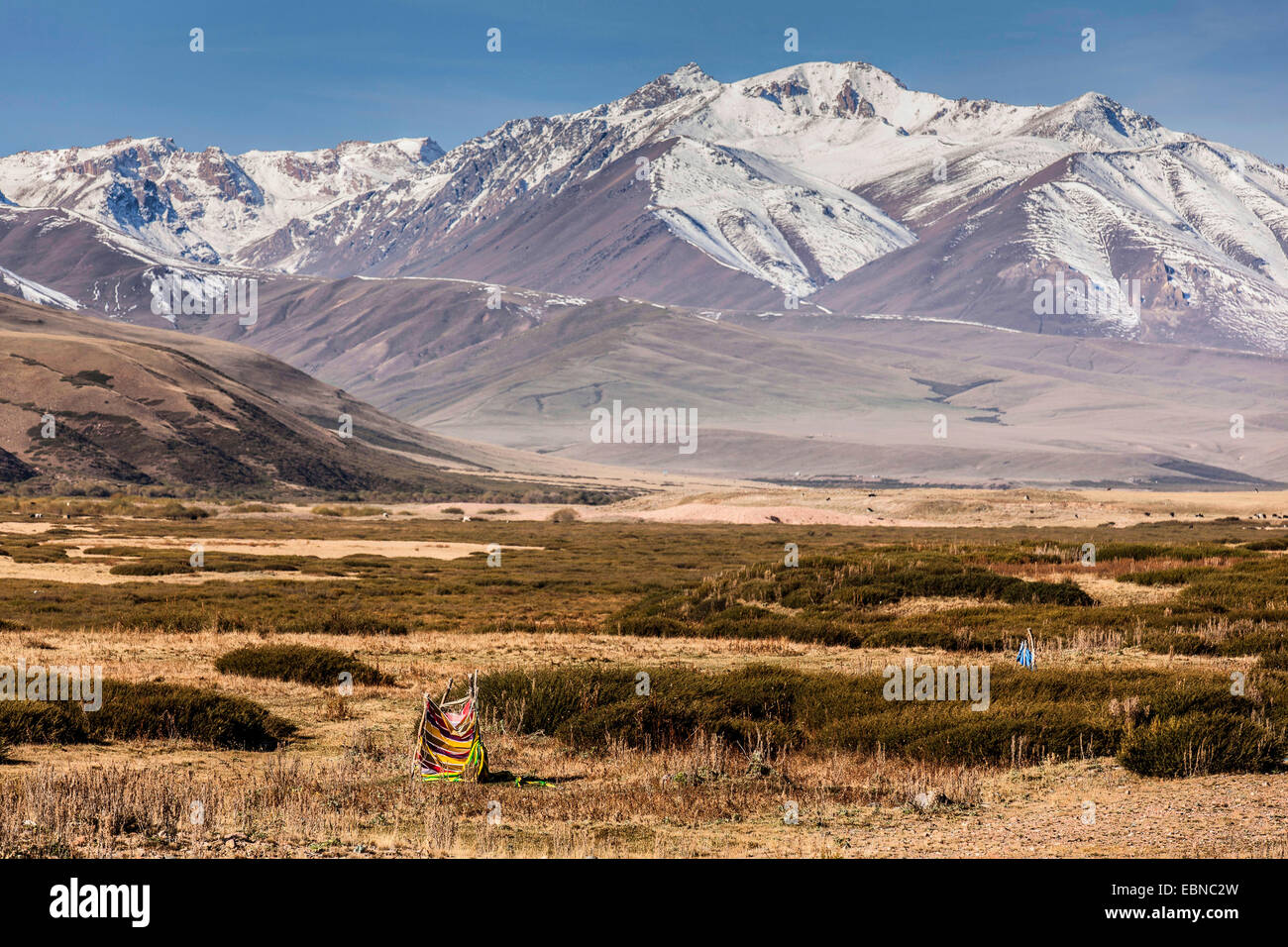 open air toilette in steppe, snow-caped mountain range in background, Kyrgyzstan, Djalalabad, Taskoemuer Stock Photo