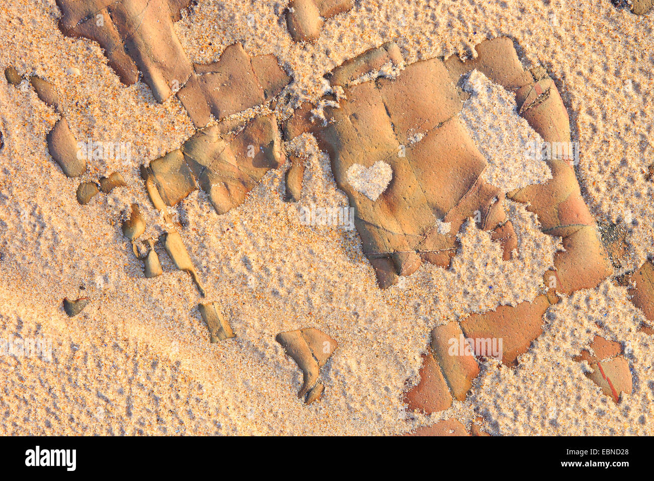structures of rock with a small heart from sand, United Kingdom, Scotland, Sutherland Stock Photo