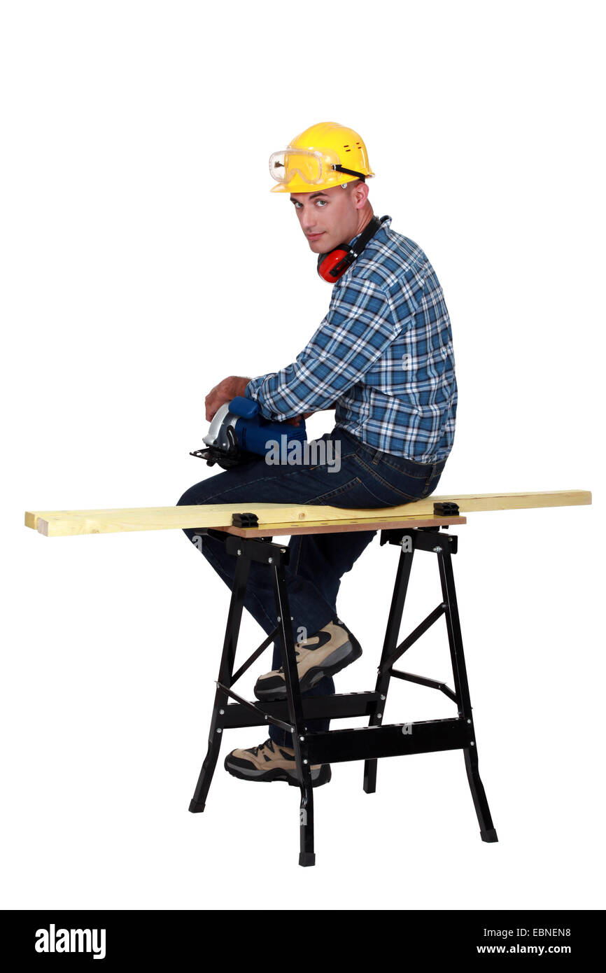Carpenter sitting on bench Stock Photo