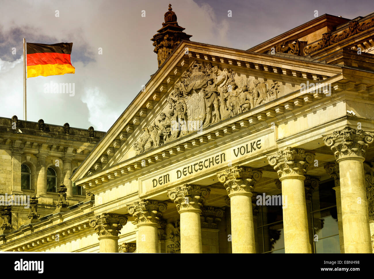 German flag blowing on Reichstag, Germany, Berlin Stock Photo