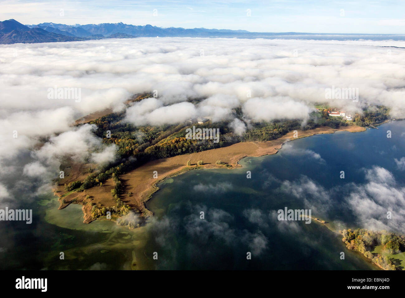 aerial view to Herrenchiemsee and low stratus, Alps in background, Germany, Bavaria, Lake Chiemsee Stock Photo