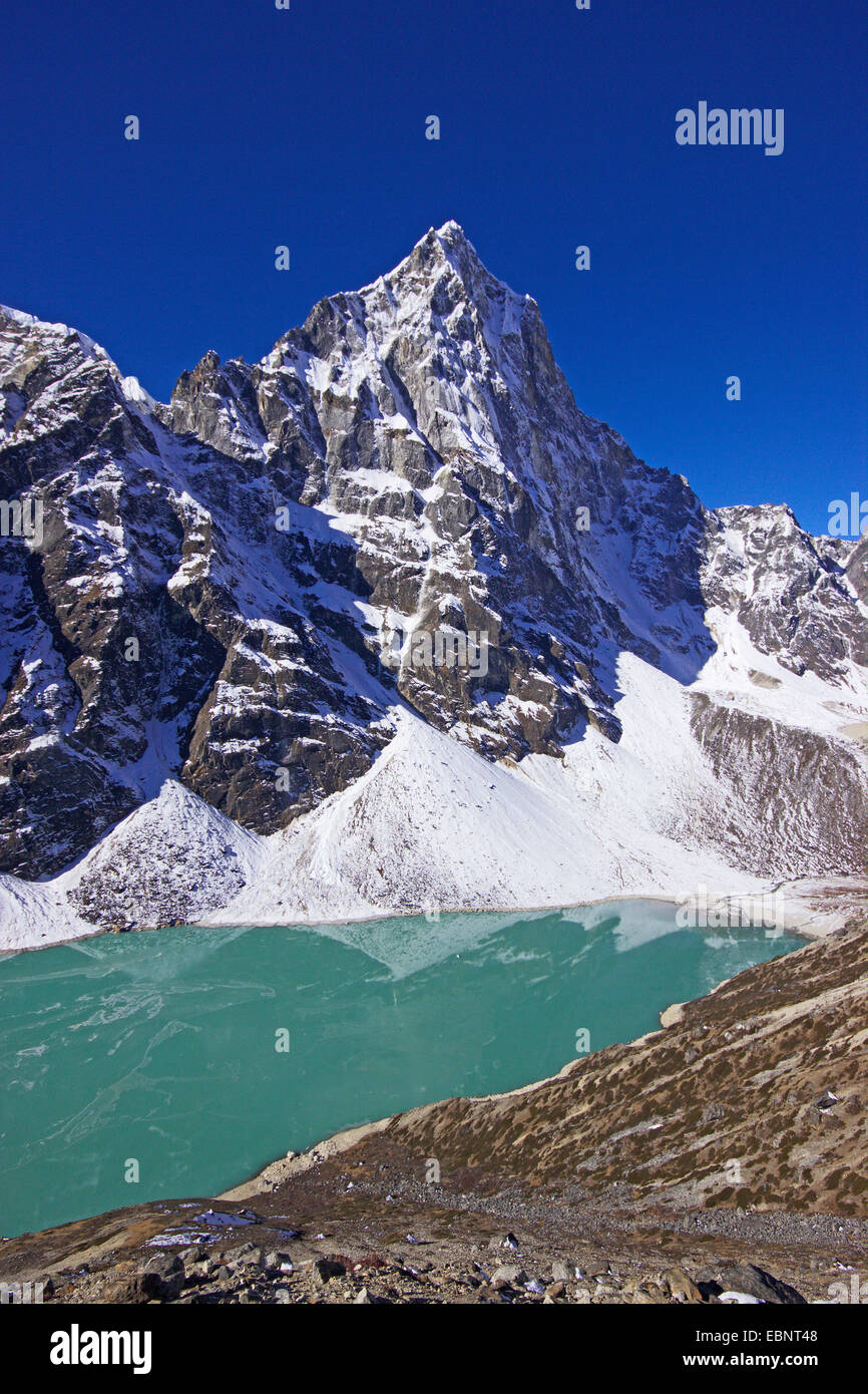 Cholatse behind lake Chola Tsho , Nepal, Himalaya, Khumbu Himal Stock Photo