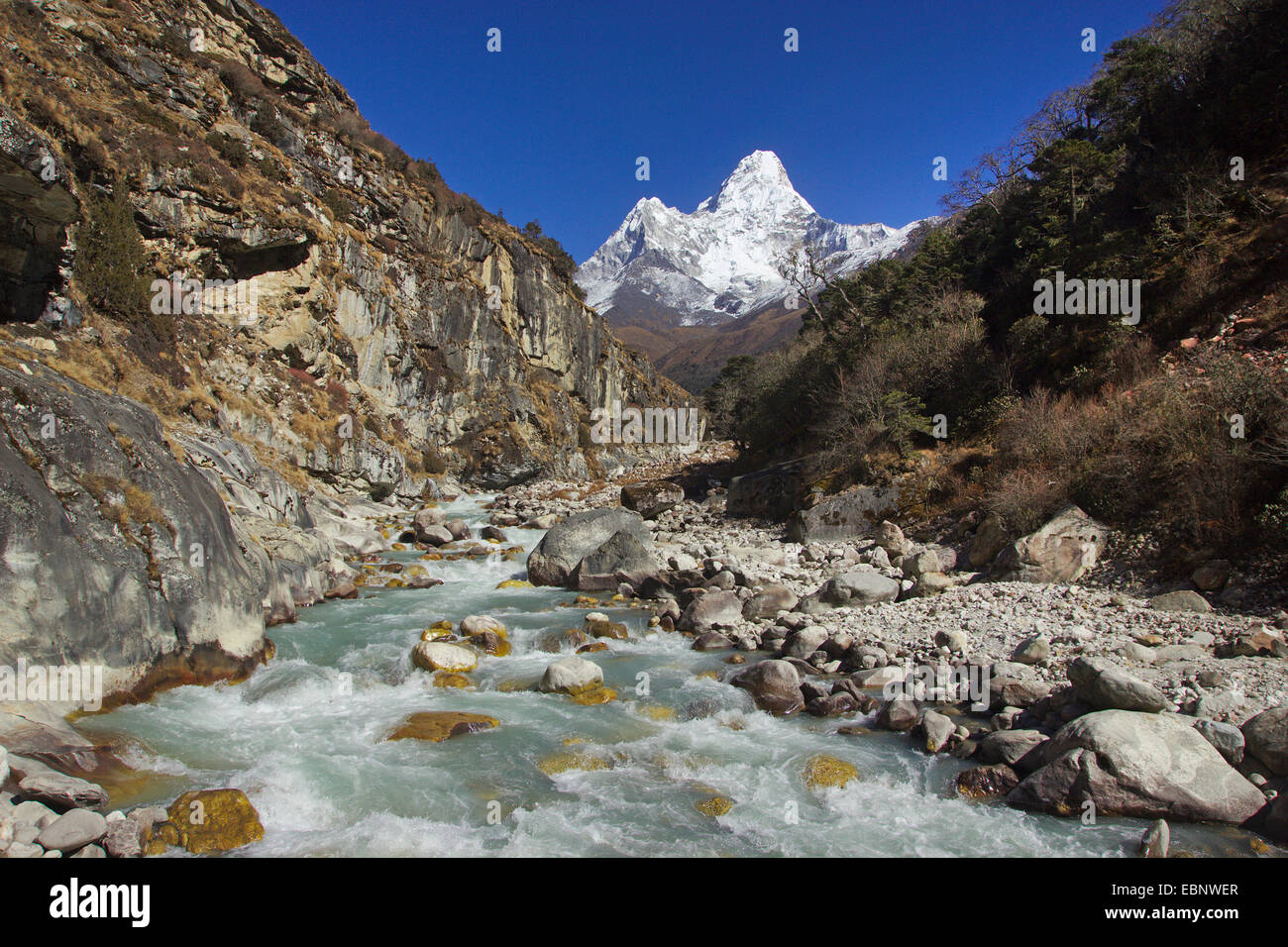 view to Ama Dablam and running mountain creek, Nepal, Himalaya, Khumbu Himal, Pangboche Stock Photo