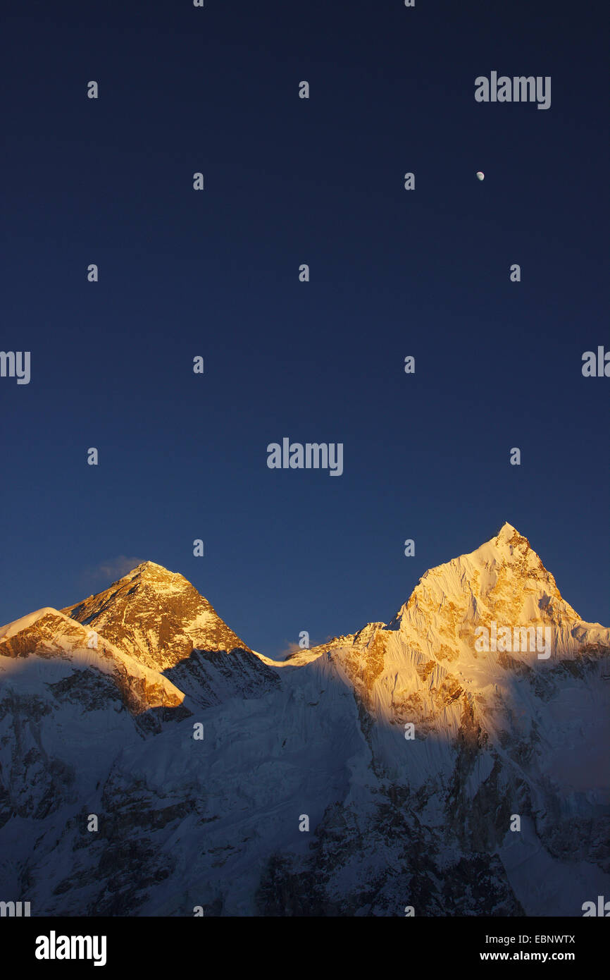 Mount Everest, Nuptse and moon in evening light. View from Kala Patthar., Nepal, Himalaya, Khumbu Himal Stock Photo