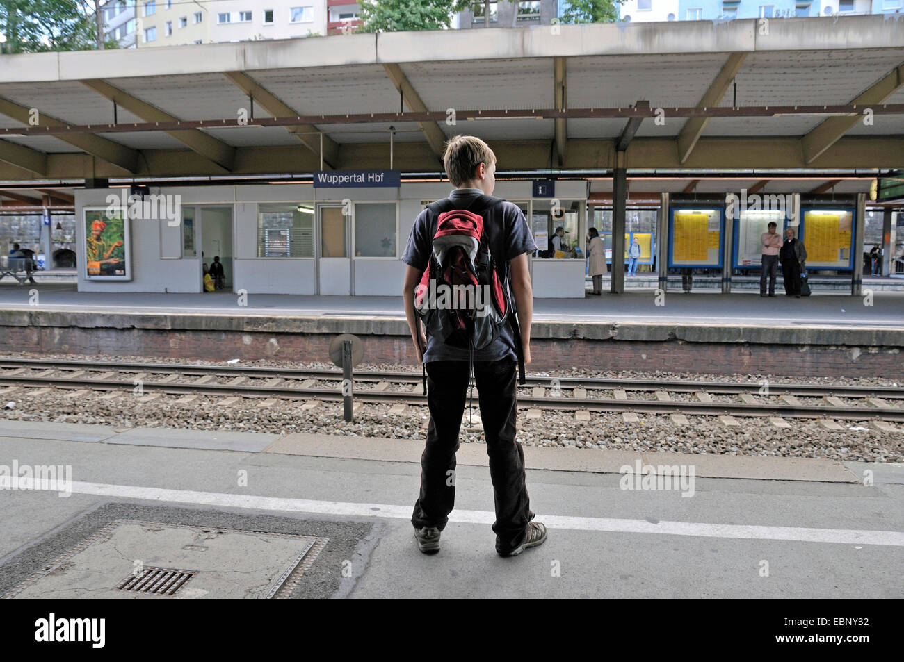 10 years old boy at Wuppertal main station waiting for the train, Germany, North Rhine-Westphalia, Wuppertal Stock Photo