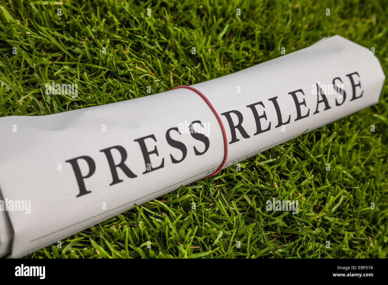 press release newspaper on meadow Stock Photo