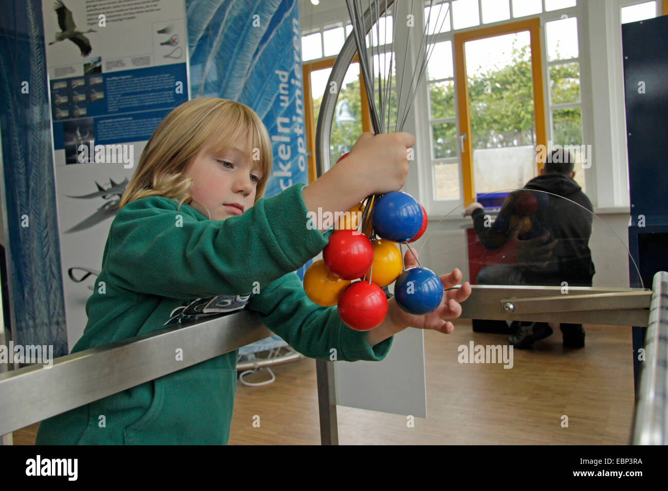 little boy playfully experimenting in the Experimentarium Zingst, Germany Stock Photo