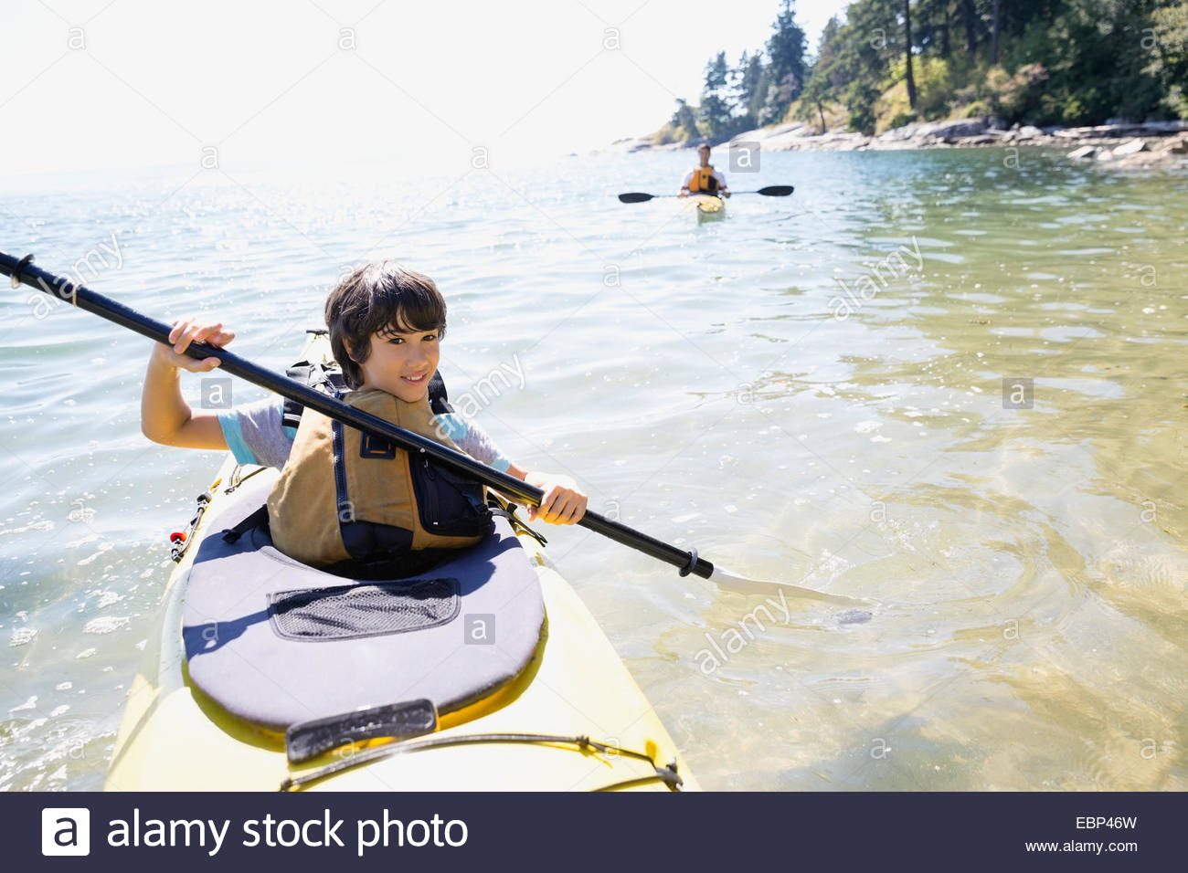 Portrait of boy kayaking in ocean Stock Photo