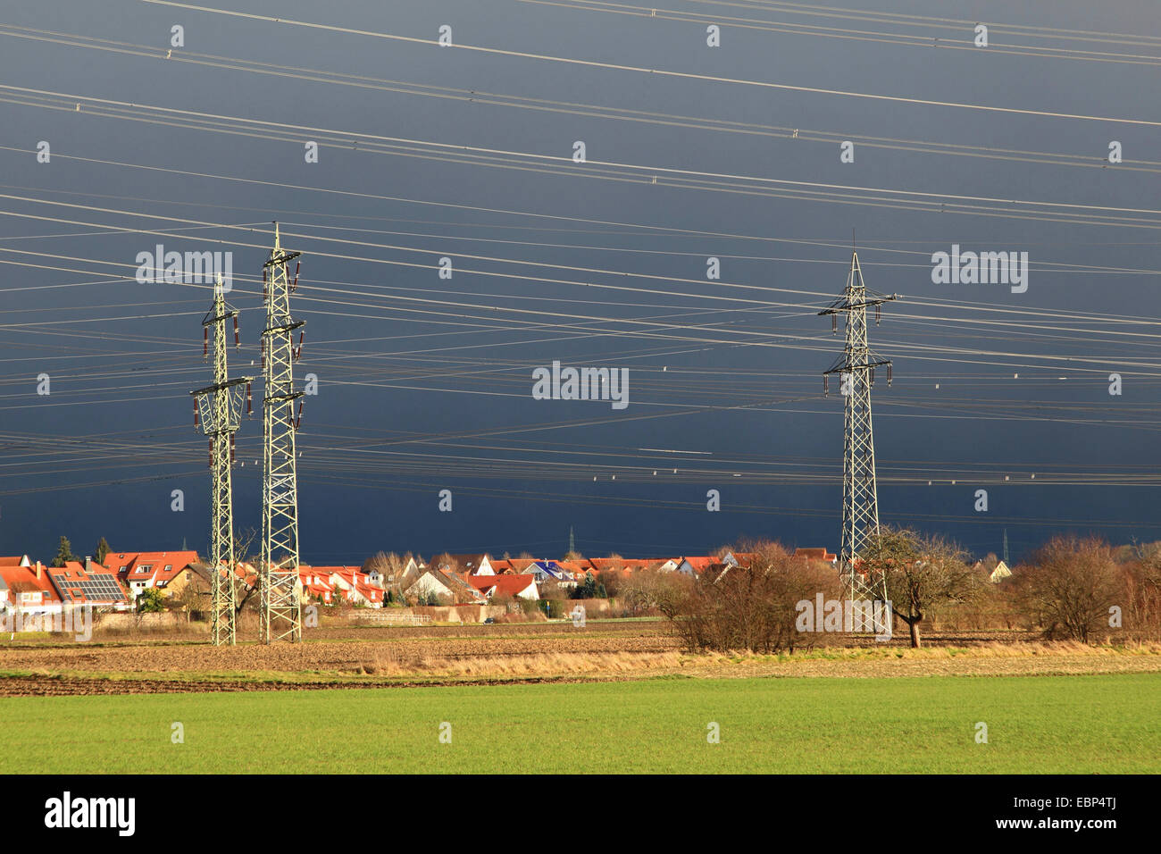 power poles in before thunder clouds, Germany, Baden-Wuerttemberg, Seckenheim Stock Photo