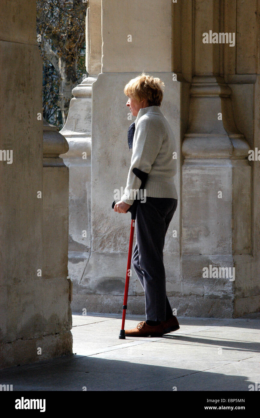 Walking-handicapped woman Stock Photo