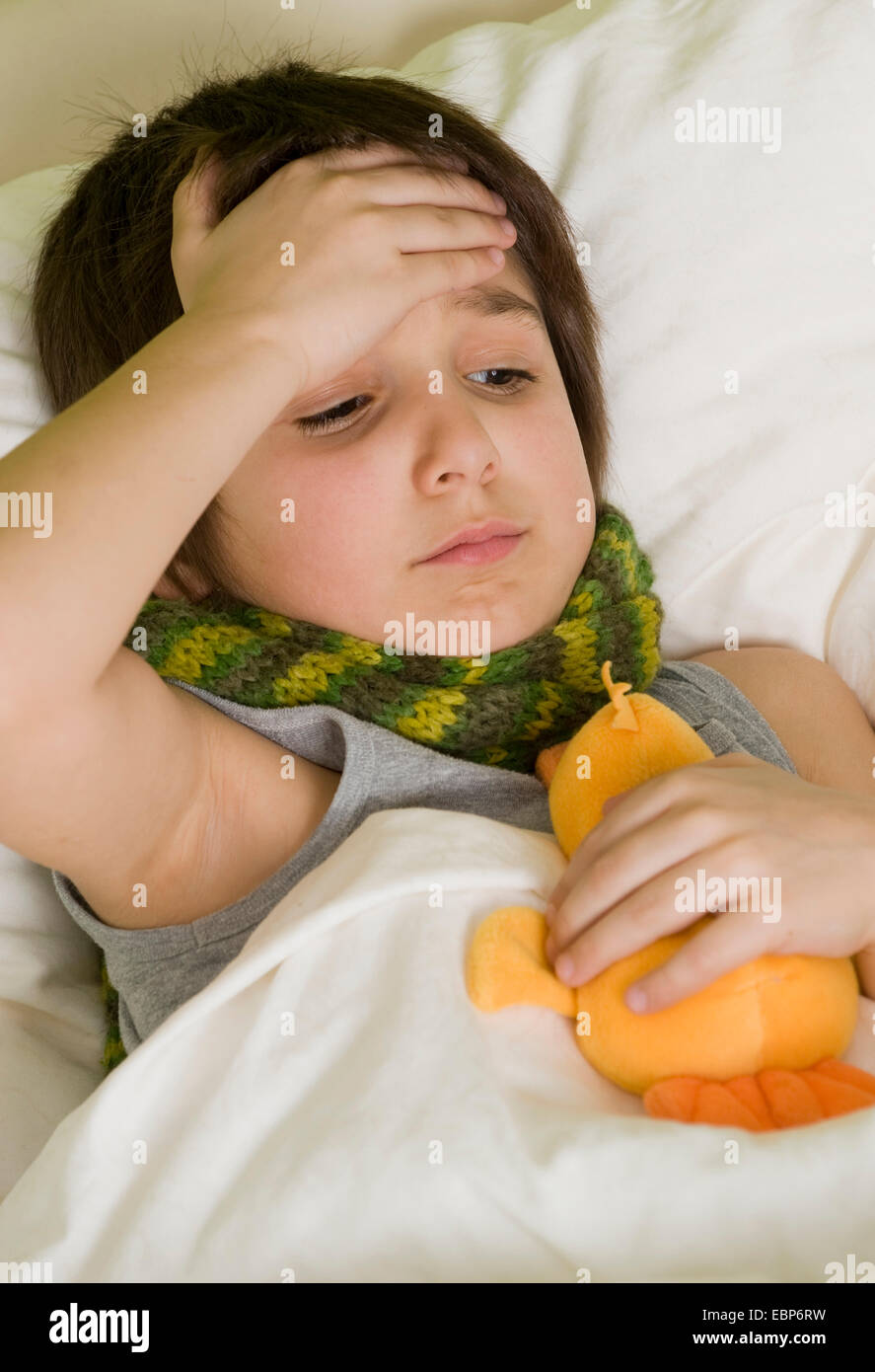 sick boy in bed Stock Photo