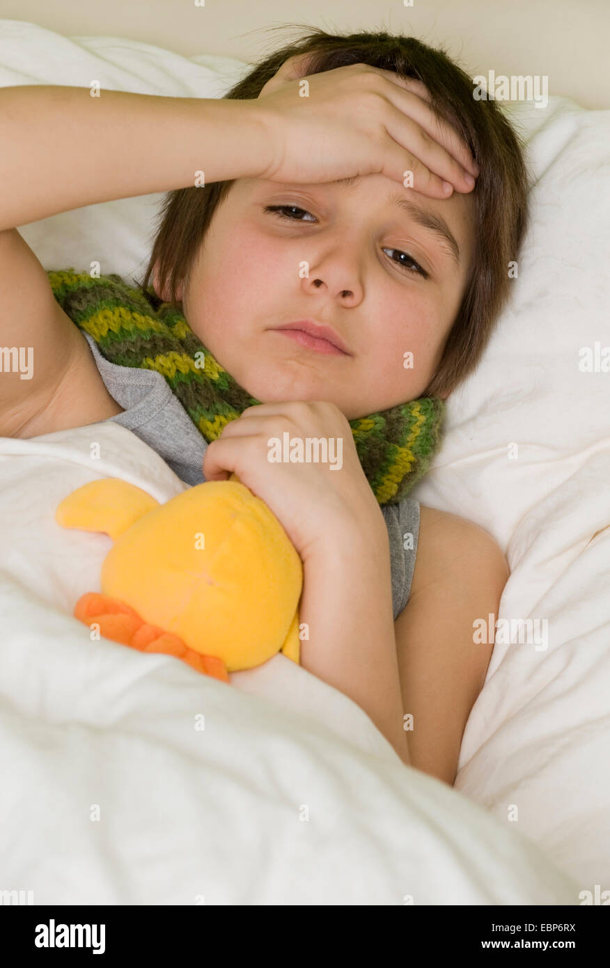 sick boy in bed Stock Photo