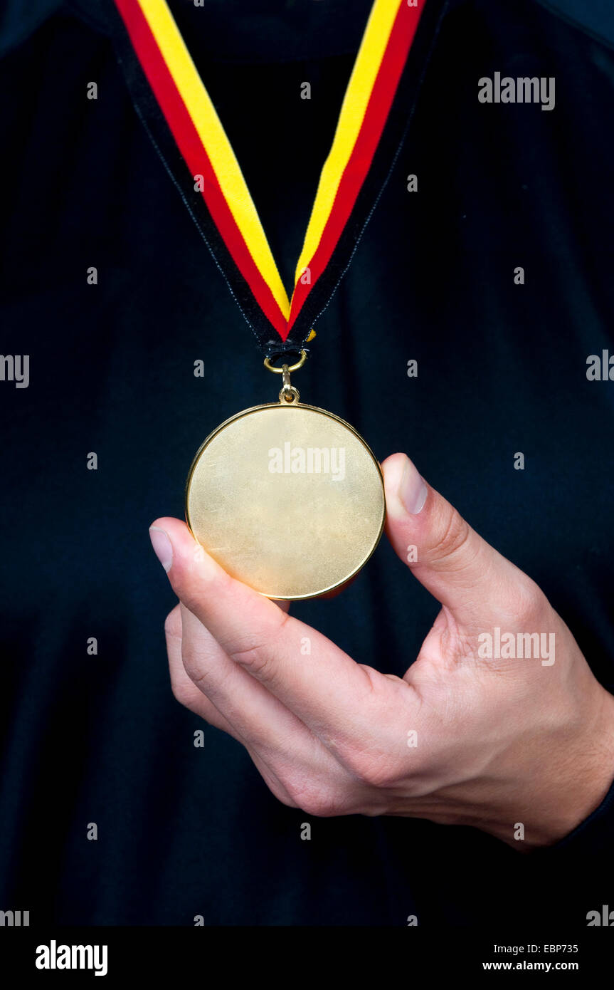 winner holding his gold medal in his hand, Germany Stock Photo