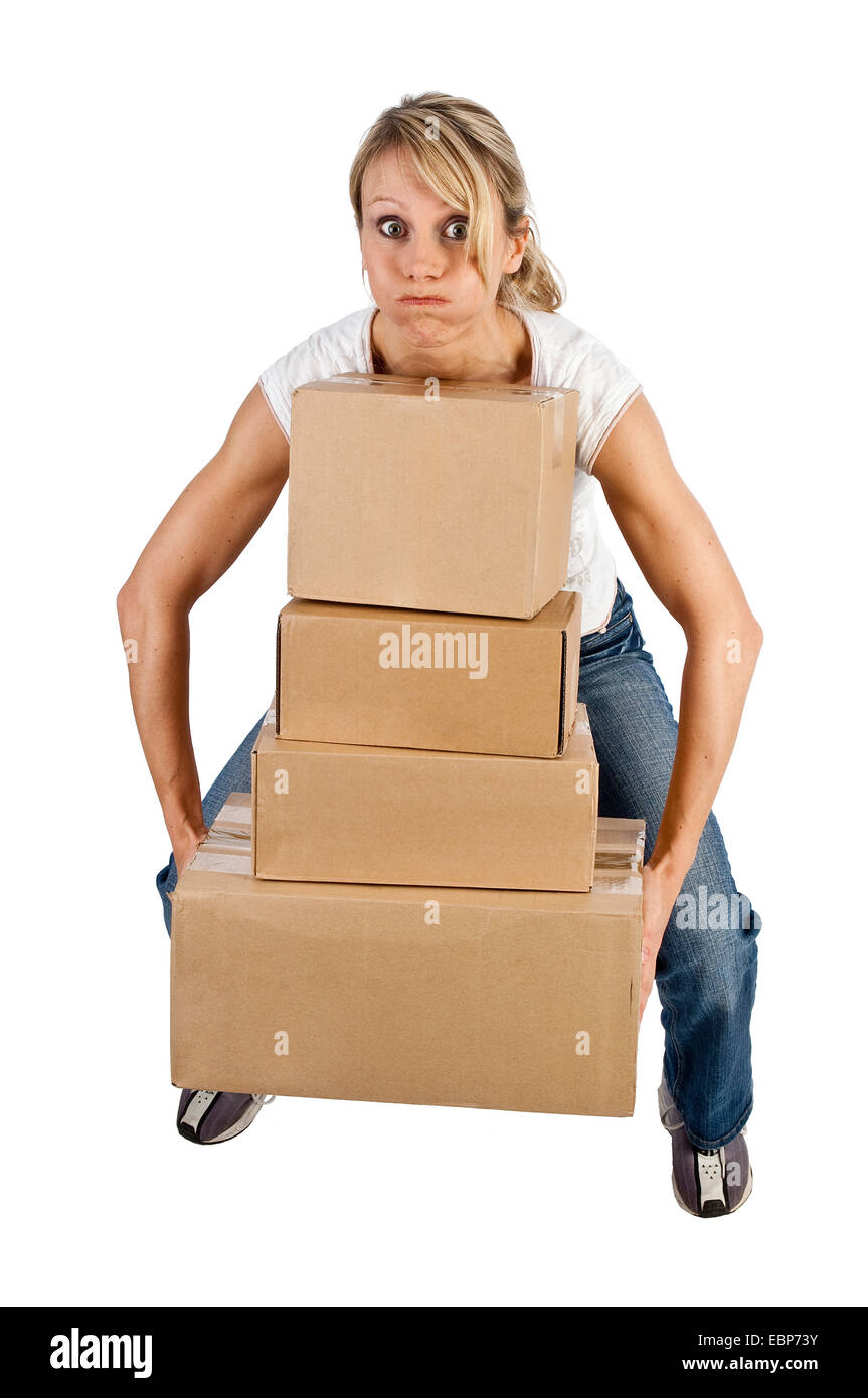 young woman carrying boxes, Germany Stock Photo
