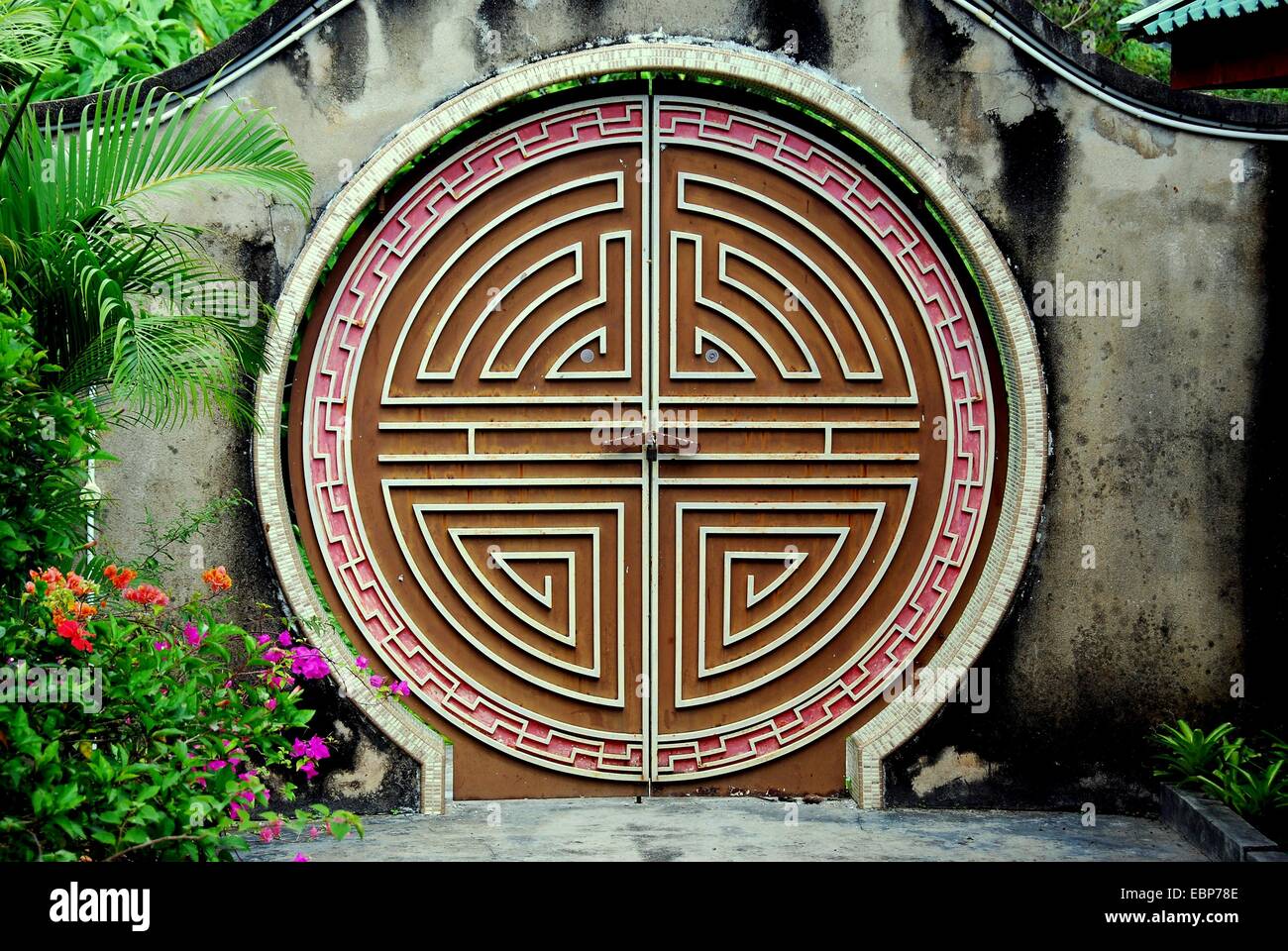 PENANG, MALAYSIA:  A laybrinth moongate doorway in the gardens at the Snake Temple on Penang Island  * Stock Photo
