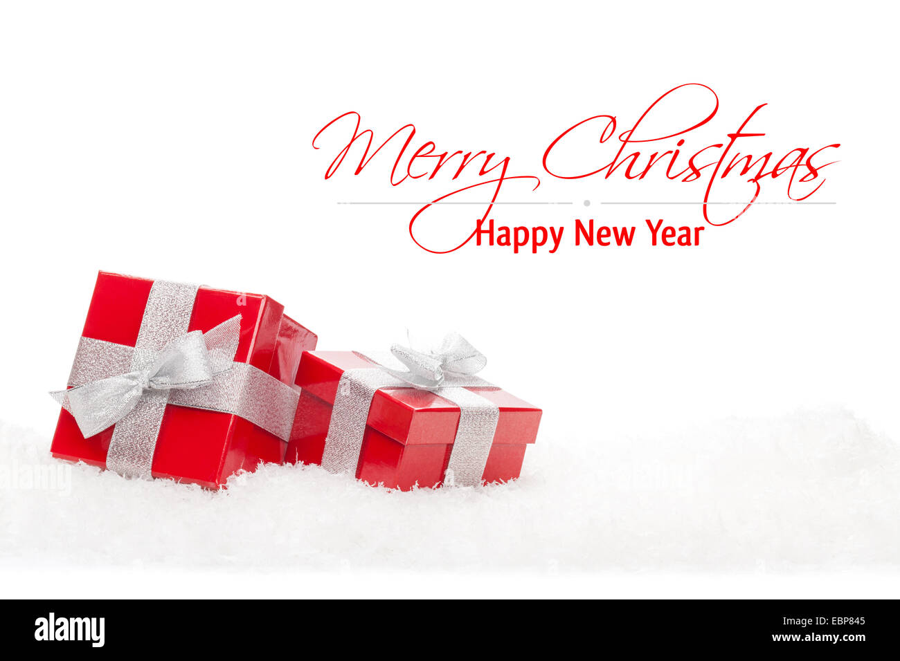 Red gift boxes in snow. Isolated on white background with copy space ...