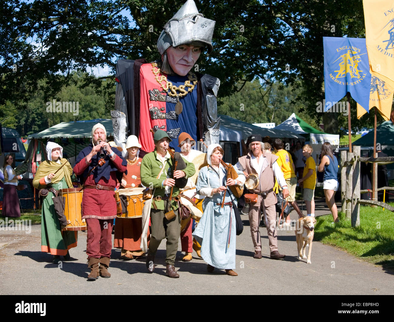 Herstmonceux, East Sussex, England. Musical troupe on parade at medieval festival in the grounds of Herstmonceux Castle. Stock Photo