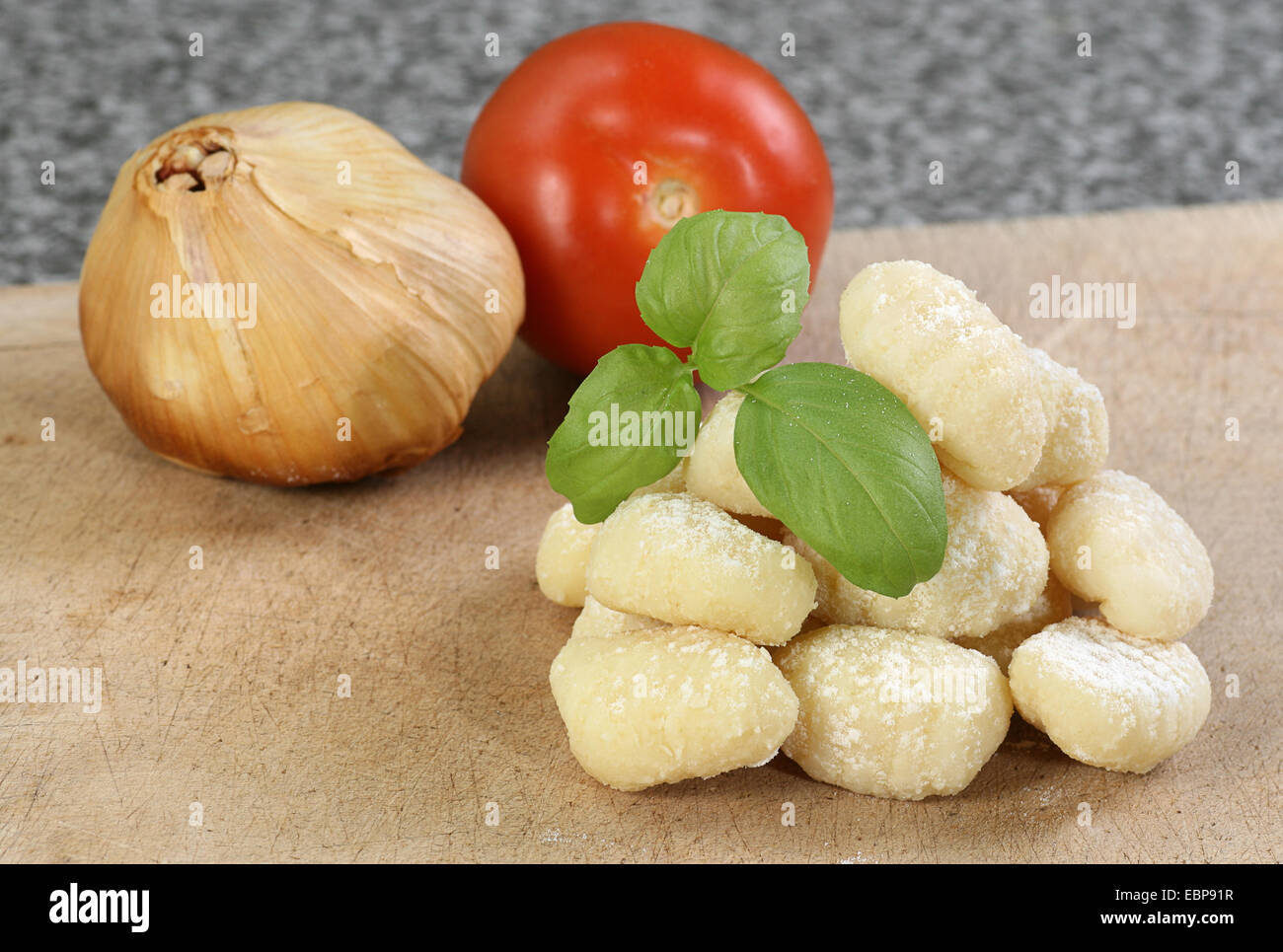 uncooked gnocchi with tomato basil and smoked garlic Stock Photo