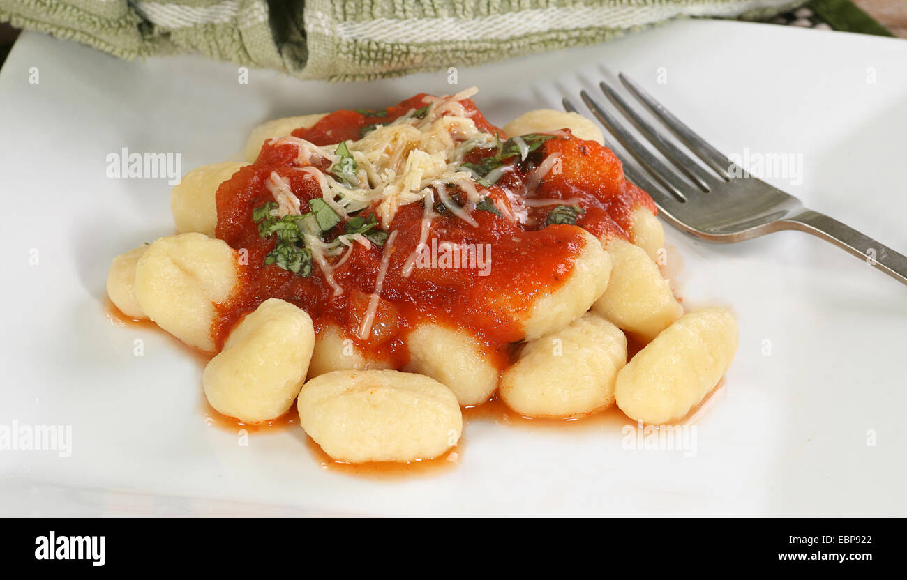 cooked gnocchi with arrabbatia sauce basil and grated cheese Stock Photo