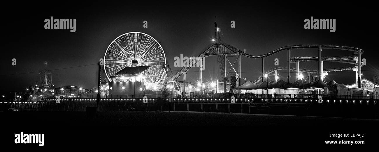 Ferris wheel on Santa Monica Pier lit up at dusk, Santa Monica, Los Angeles County, California, USA Stock Photo