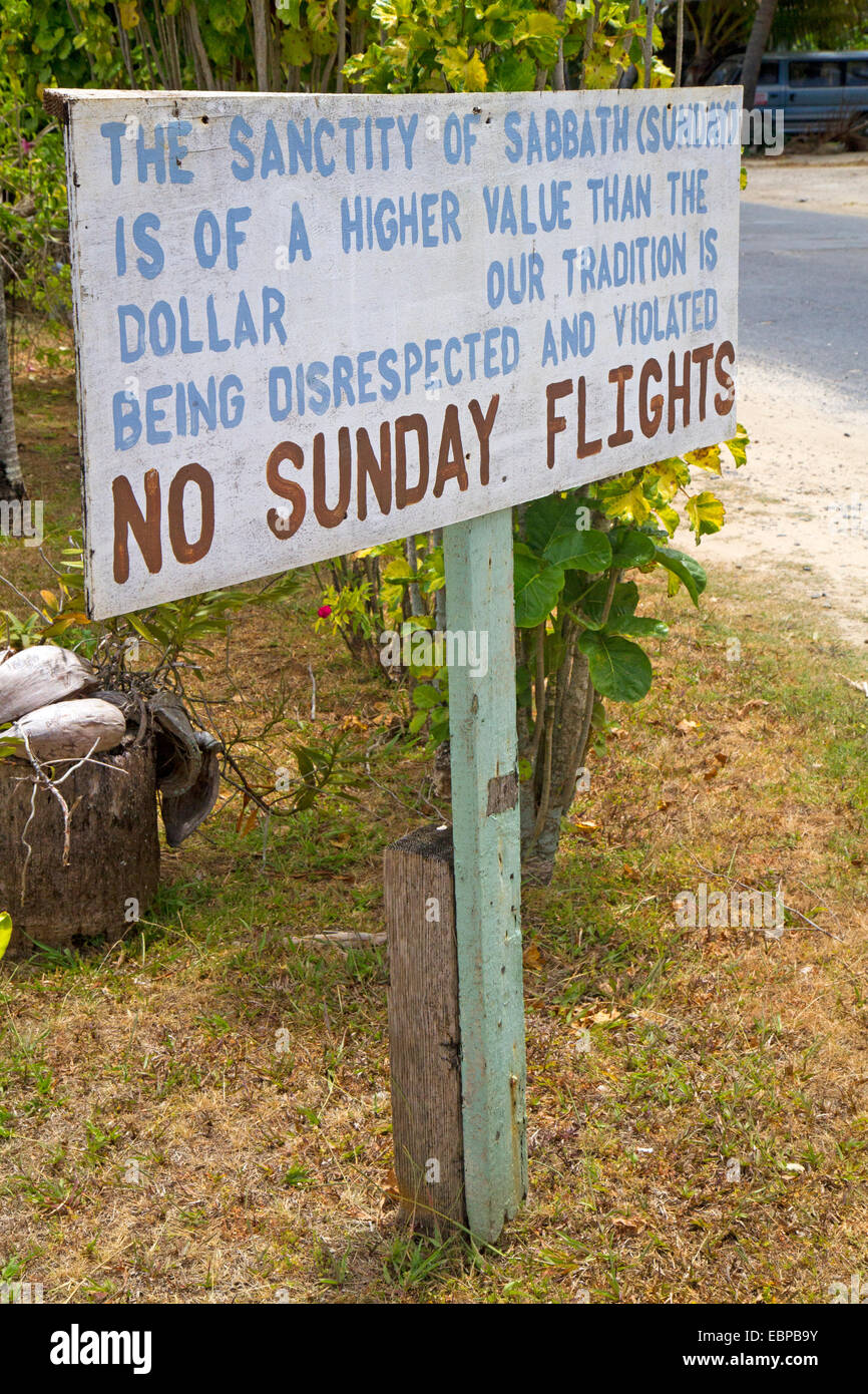 Sign protesting Sunday flights in Aitutaki Stock Photo