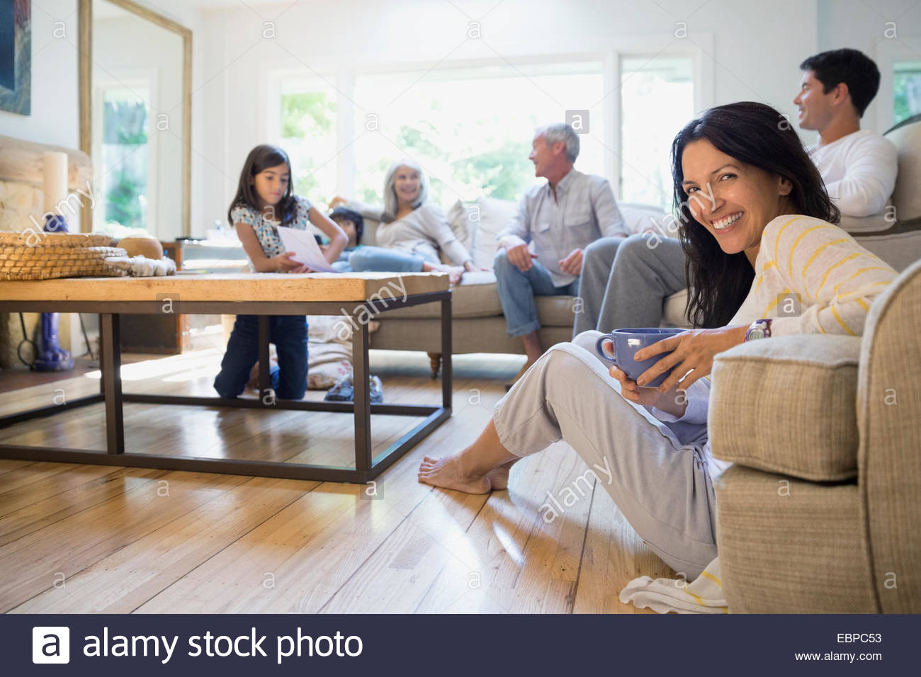 Multi-generation family relaxing in living room Stock Photo - Alamy