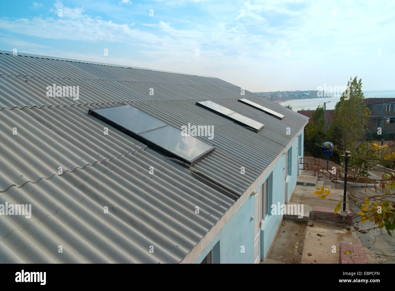 Solar water heating system on the house roof Stock Photo - Alamy