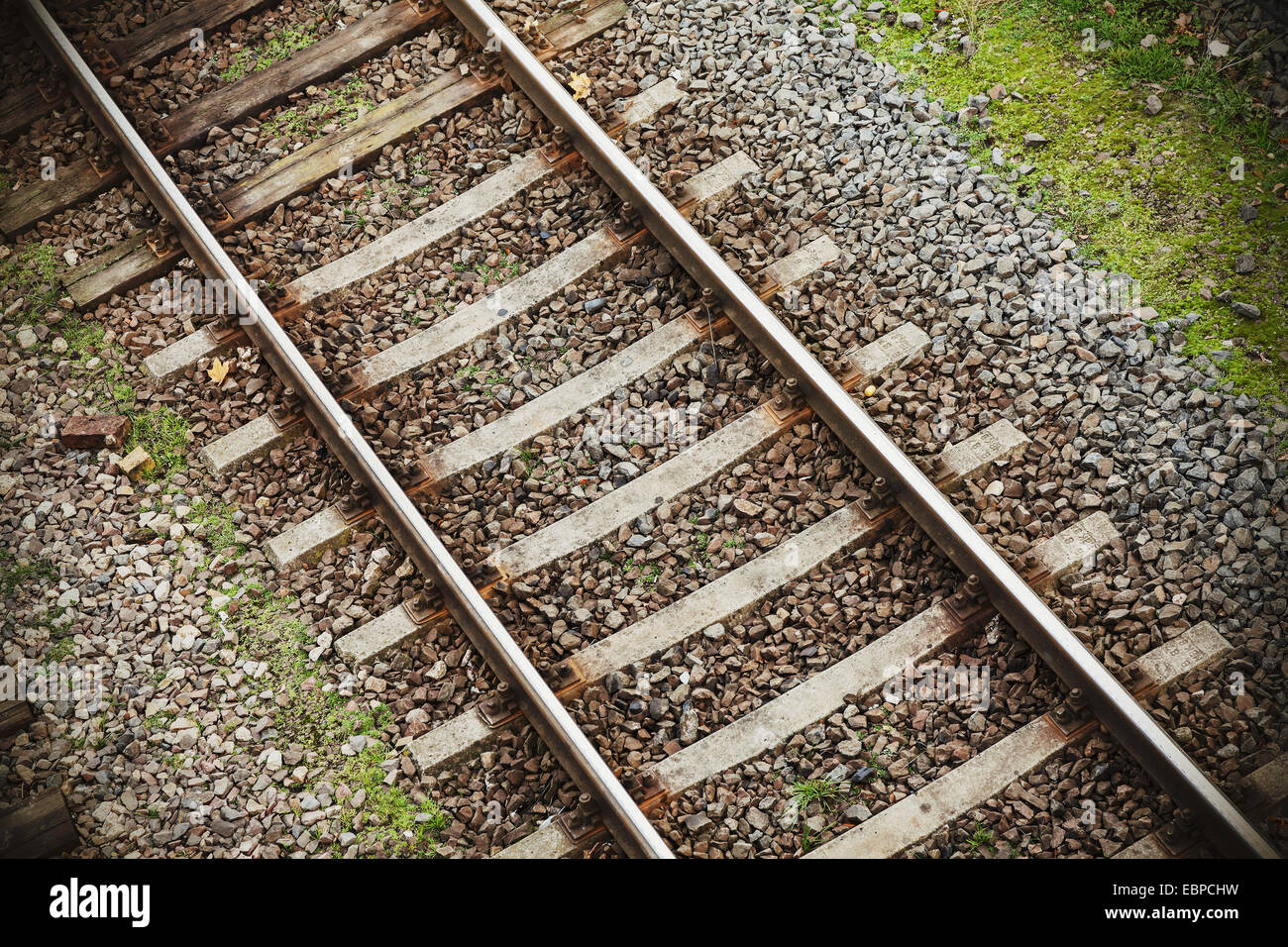 Retro filtered photo of railway tracks background. Stock Photo