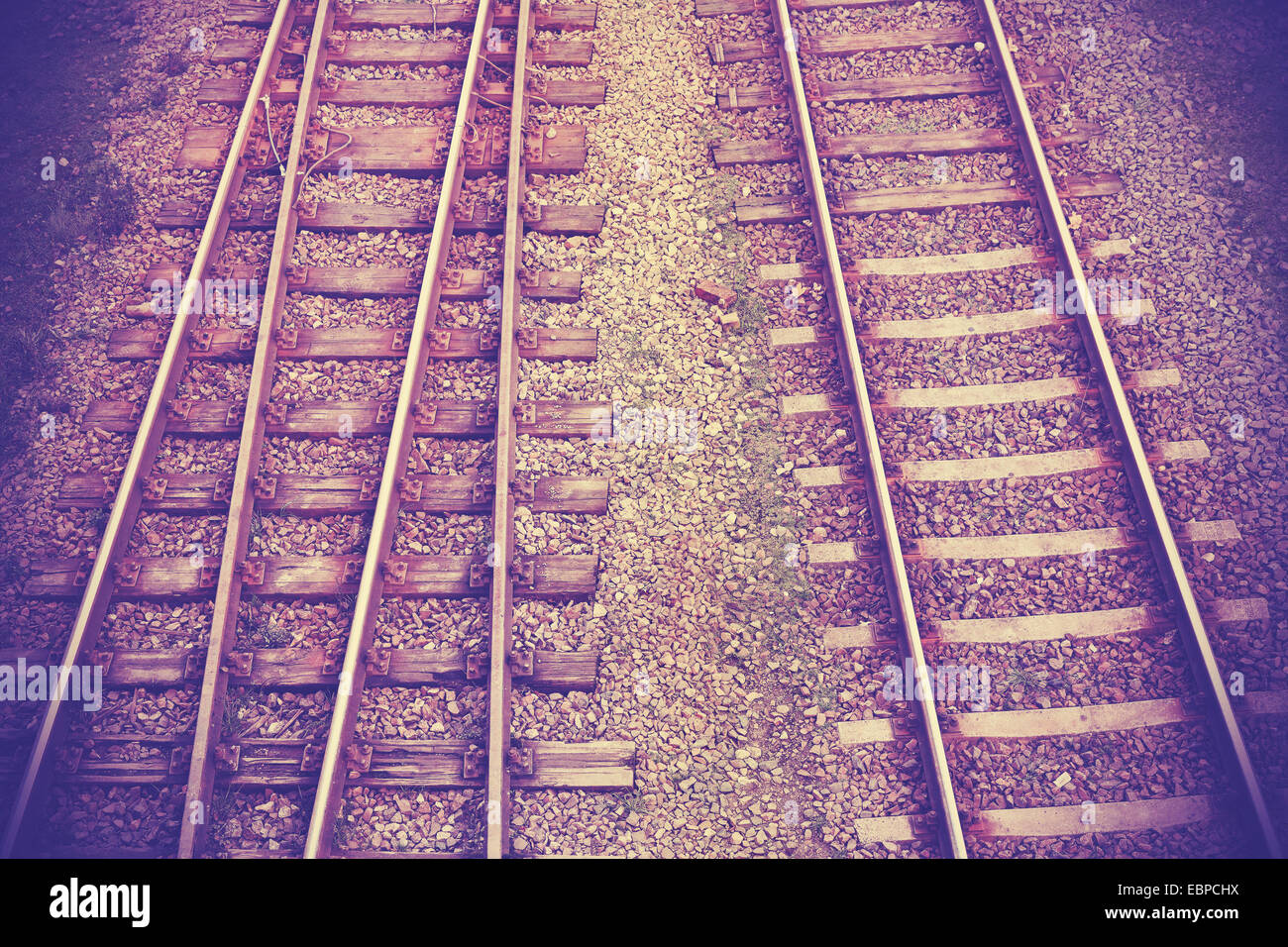 Vintage retro filtered picture of railway tracks. Stock Photo