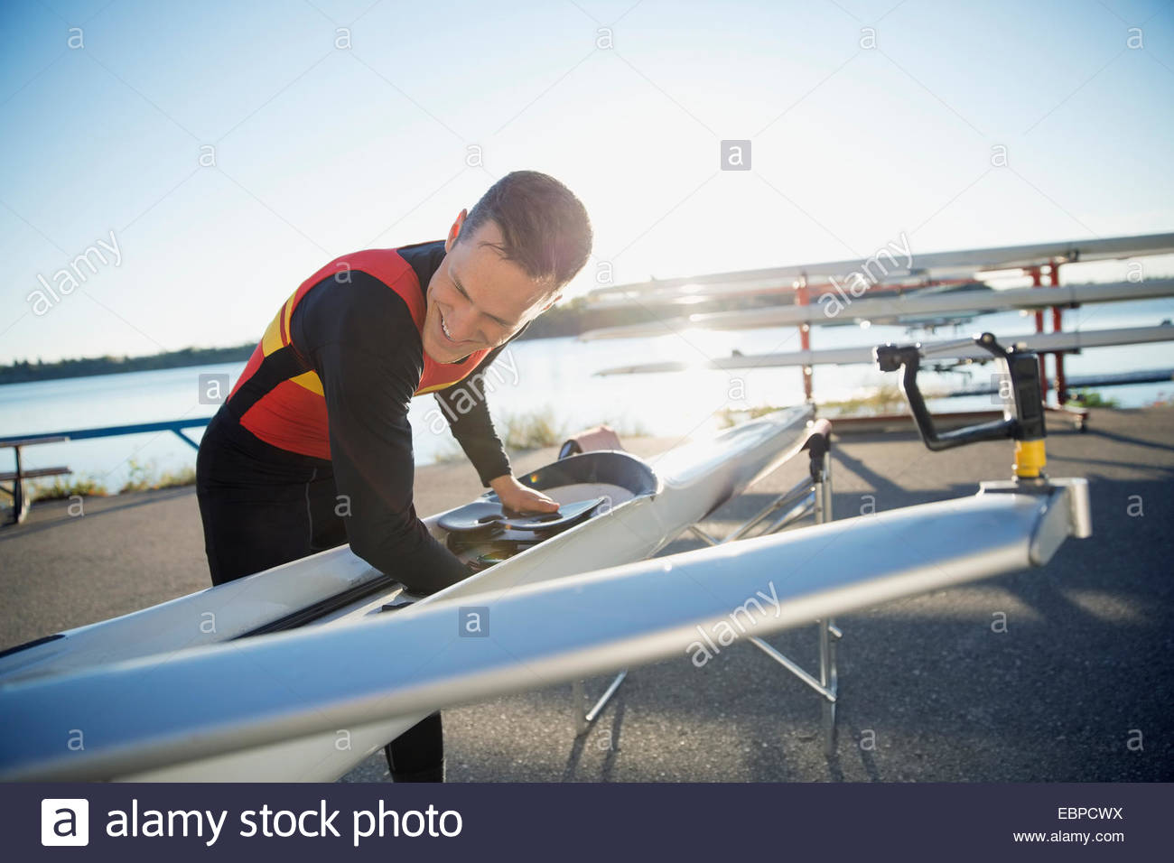 Rower with scull at waterfront Stock Photo