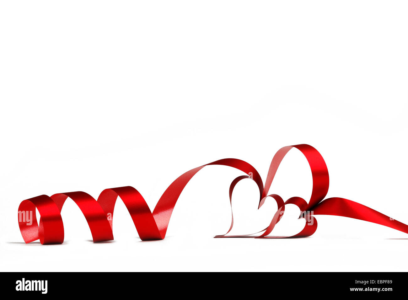 Heart shaped red ribbon isolated on white background Stock Photo - Alamy