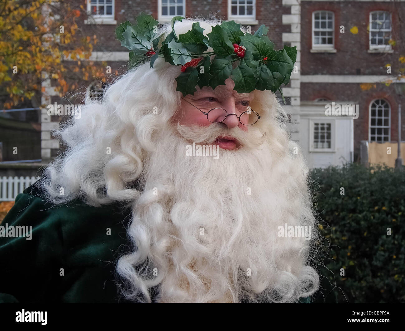 A traditional Victorian Father Christmas, Santa Clause, in his original Green costume. Stock Photo
