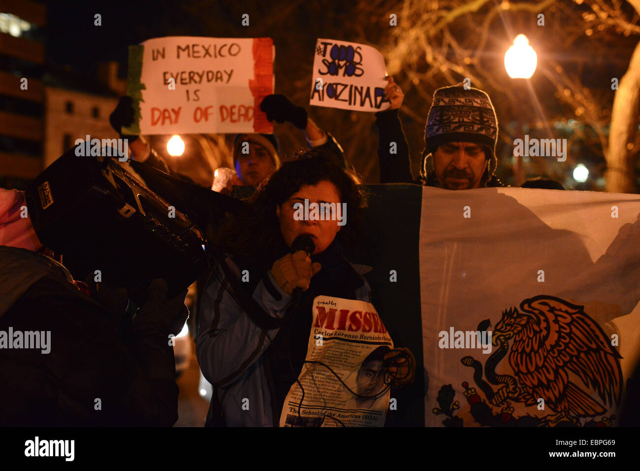 Washington DC, USA. 3rd December, 2014. Protesters rallied in Washington, DC and dozens of other U.S. cities including Ferguson, MO Wednesday night demanding justice for 42 missing Mexican students who disappeared after police opened fire on them in Guerrero state in September. A group called USTired2# organized the protests to call for an end to U.S. aid to Mexican security forces, whom they consider complicit in the disappearance of the students. Later, the group joined a march against Staten Island grand jury verdict in the case of Eric Garner. Credit:  ZUMA Press, Inc./Alamy Live News Stock Photo