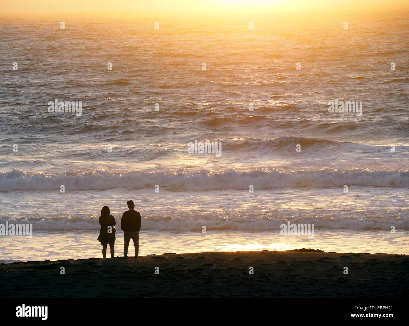 Man watching woman on beach hi-res stock photography and images - Alamy